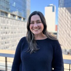 Melanie headshot on rooftop